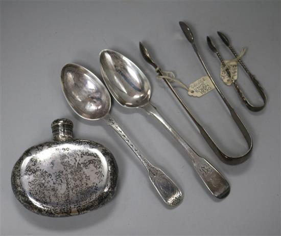 A Victorian silver spirit flask, two silver spoons and two pairs of sugar tongs.